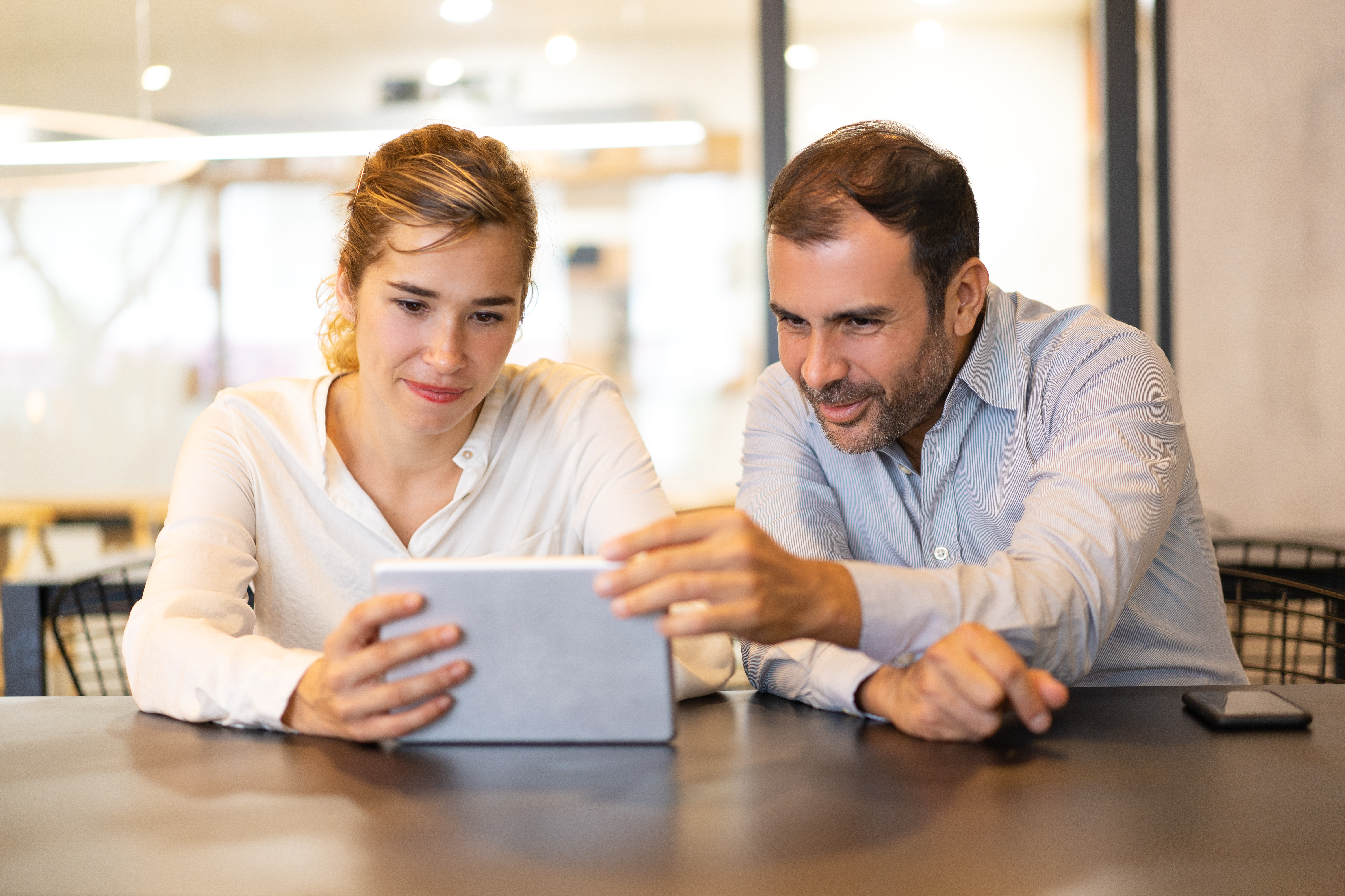 Portrait Happy Colleagues Browsing Digital Tablet Cafe